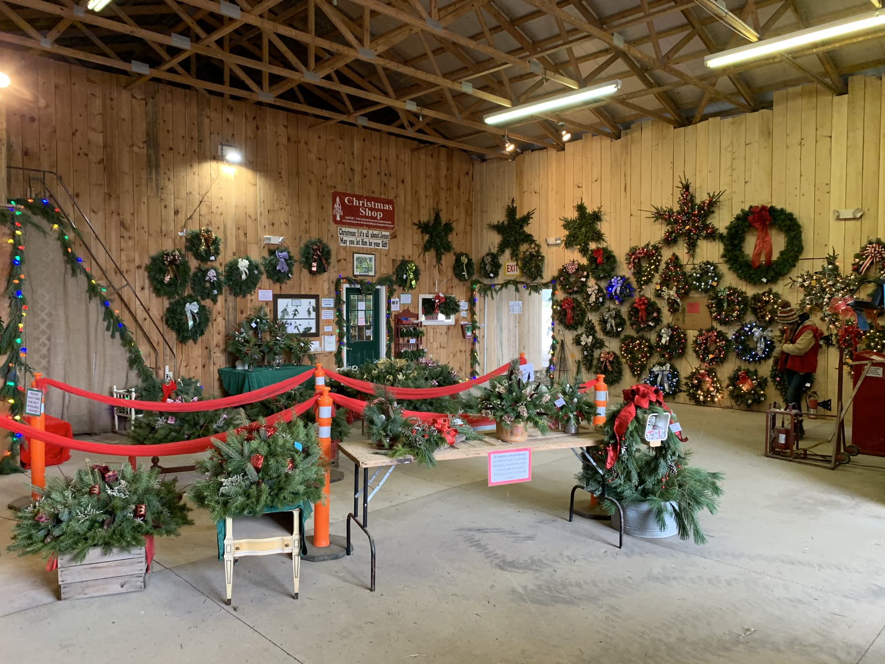 Inside the Christmas Shop: wreaths covering the timber walls