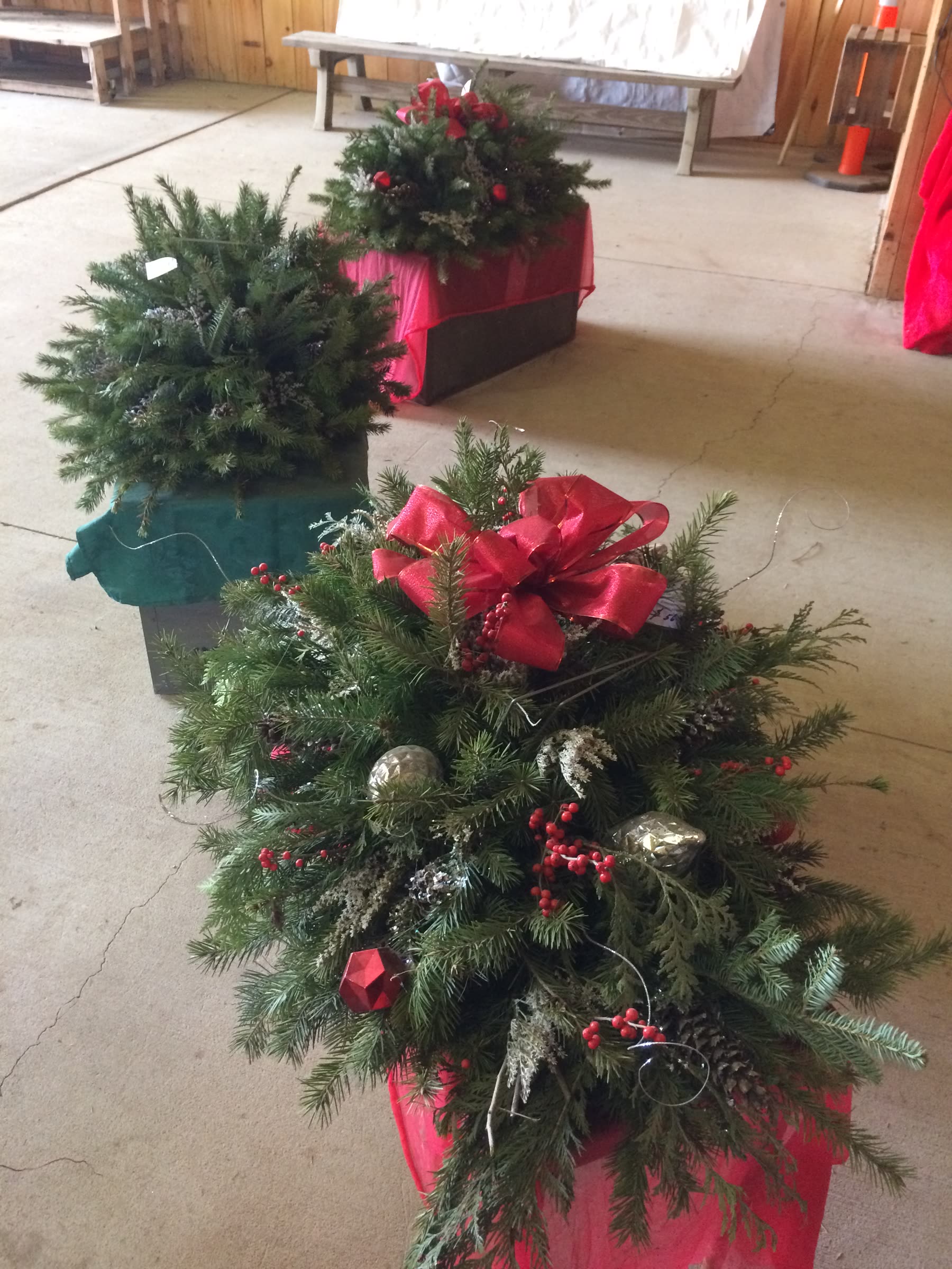 A decorated evergreen arrangement with a red bow